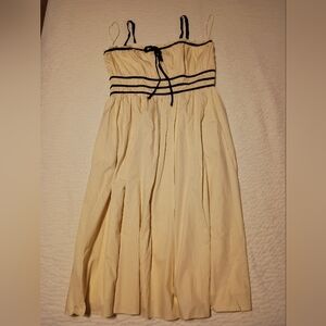 Elegant Cream Dress with Black Accents